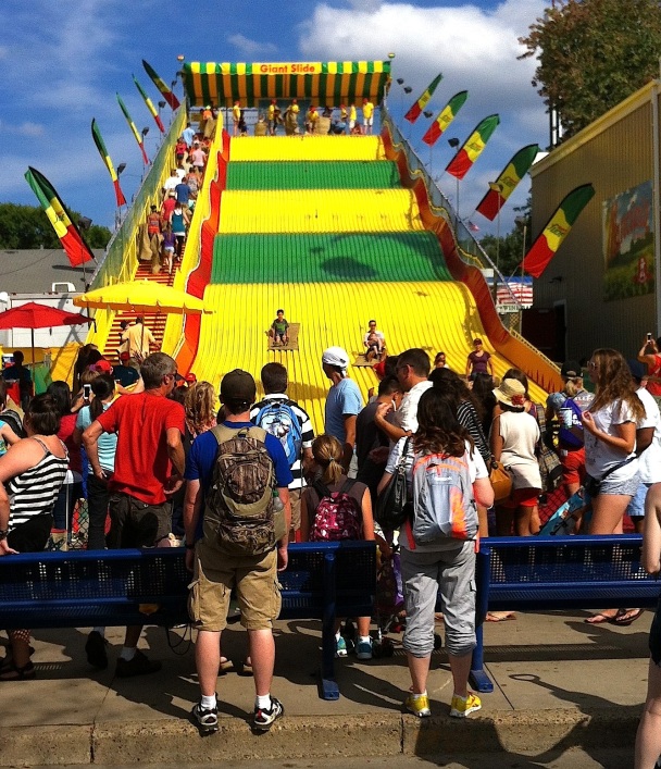 One of my colleagues told me a story about a woman he knows who visits the fair every year just to stand in front of the Giant Slide and watch the riders come down.  She described it as "witnessing moments of pure joy."